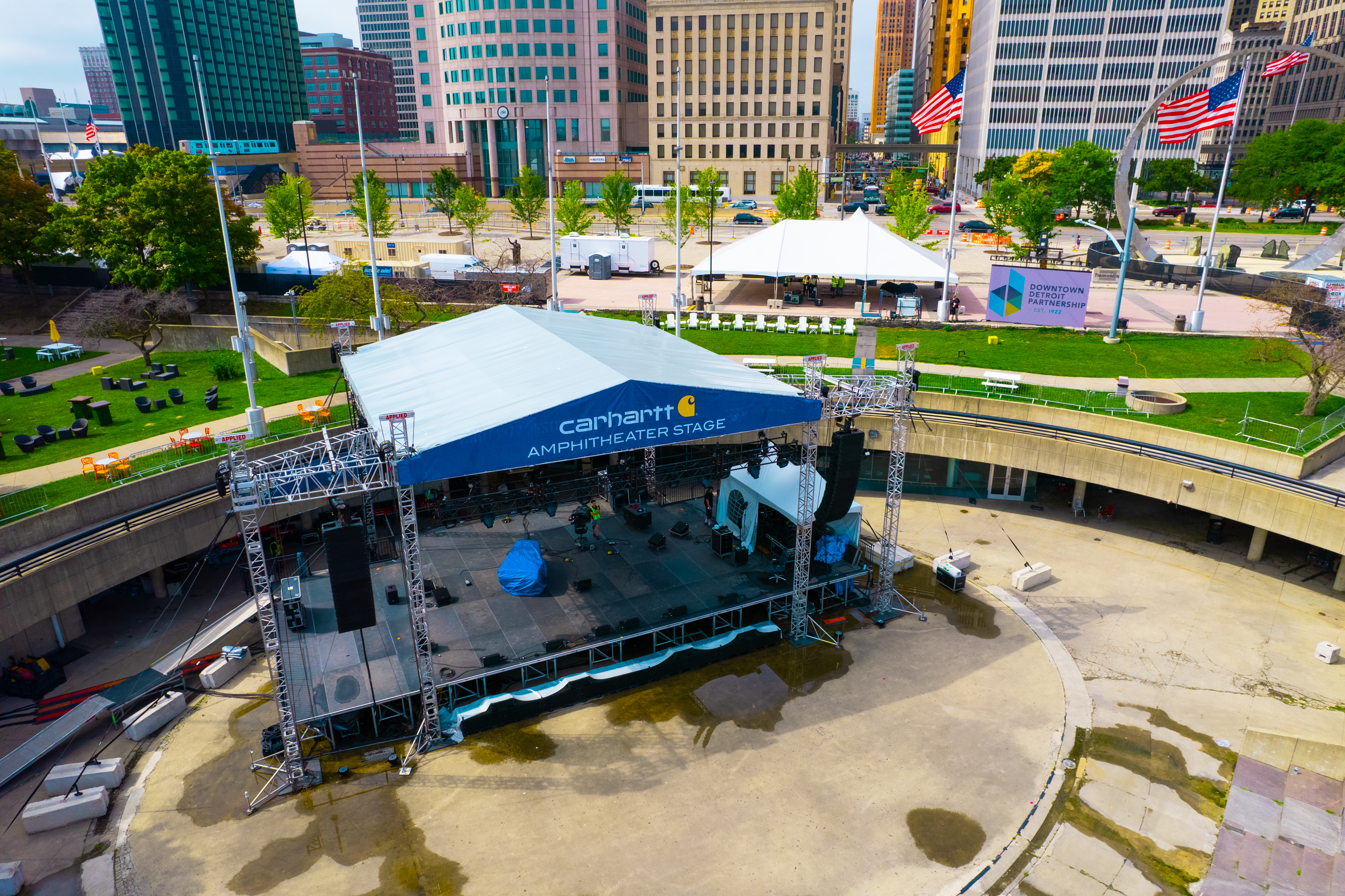 Large stage setup with tent canopy for religious and cultural event performances in Detroit